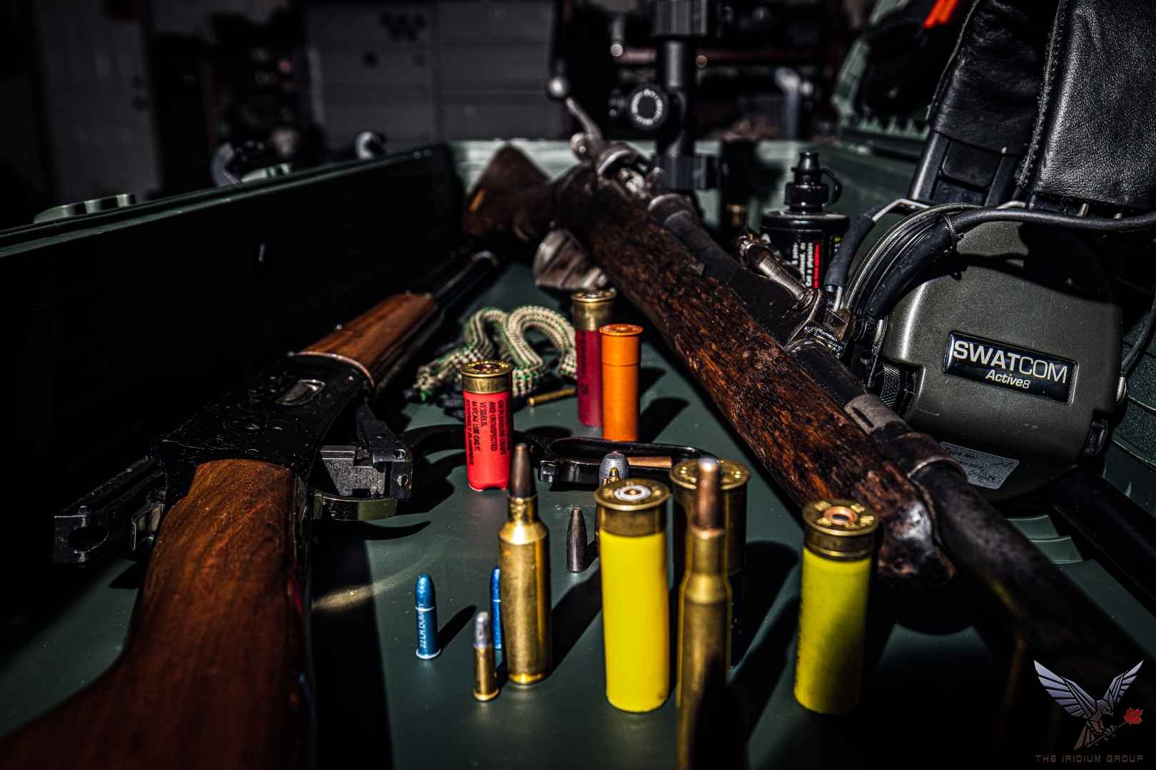 Rifle cartridges and shotgun shells of several calibres on a table